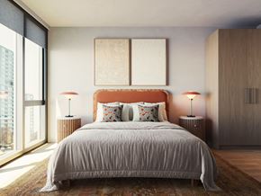 Chicago apartment for rent - A bedroom with a large bed and two lamps.