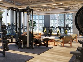 Chicago apartment for rent - A gym with a variety of equipment including weights and machines.