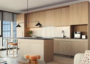 Chicago apartment for rent - A modern kitchen with wooden cabinets and a bar stool.