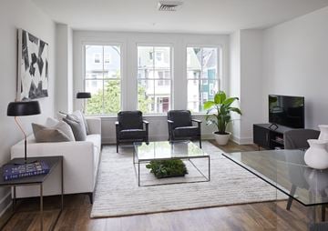 West Orange apartment for rent - a living room with a white couch and a glass coffee table