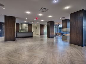 West Orange apartment for rent - A spacious lobby with wooden floors and a reception desk.