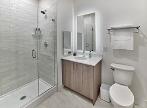 Woodbridge Township apartment for rent - a bathroom with a shower toilet sink and mirror
