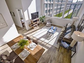 West Orange apartment for rent - A modern dining room with a wooden table and chairs.