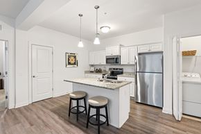 Mechanicsburg apartment for rent - A kitchen with a white counter and a refrigerator.