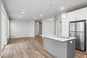 Mount Joy apartment for rent - A modern kitchen with a stainless steel refrigerator and a center island.