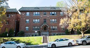 Pittsburgh apartment for rent - a large brick building with cars parked in front of it