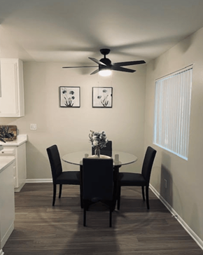 Riverside apartment for rent - A dining room with a table set for two.