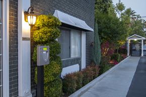 Riverside apartment for rent - a mailbox on a sidewalk in front of a brick building