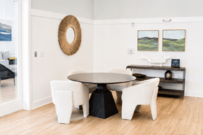 Gulf Breeze apartment for rent - A white dining room with a round table and chairs.