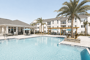 Gulf Breeze apartment for rent - A large swimming pool in front of a resort.