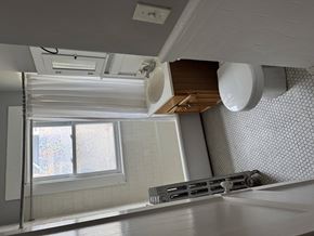 Jamaica Plain apartment for rent - A kitchen with a window and a sink.