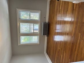 Jamaica Plain apartment for rent - A window with a white frame is on the wall.