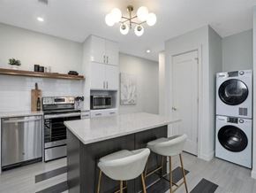 Detroit apartment for rent - a kitchen with a counter top and a washing machine