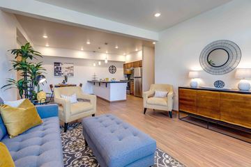Spokane Valley apartment for rent - a living room with couches and chairs and a kitchen