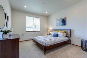 Spokane Valley apartment for rent - a bedroom with a bed and a dresser