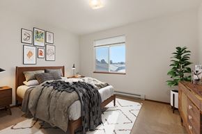 Spokane apartment for rent - a bedroom with a large bed and a window