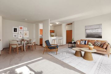 Spokane apartment for rent - a living room with a couch and a dining room table