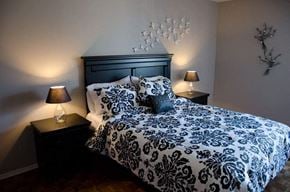 Toronto apartment for rent - a bedroom with a bed and two lamps