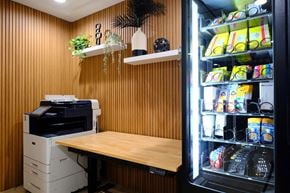 Toronto apartment for rent - a small kitchen with a table and a refrigerator