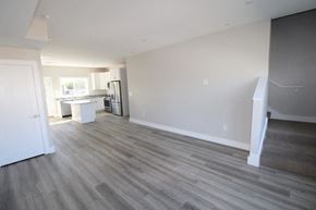 Middletown apartment for rent - an empty living room and kitchen in a new home