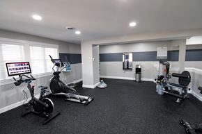 Middleboro apartment for rent - a home gym with exercise equipment and a large window
