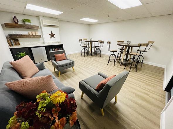 Franklin apartment for rent - a living room with couches and chairs and a dining room table