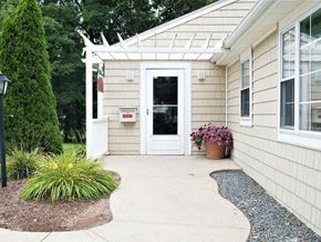 Middleboro apartment for rent - a front door of a house with a walkway and plants
