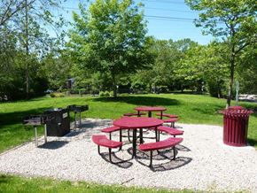 Kingston apartment for rent - a picnic area with benches and tables in a park