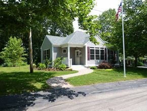 Kingston apartment for rent - a small house with a flag on the side of a street