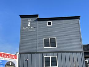 Middletown apartment for rent - a gray building with a sign on the side of it