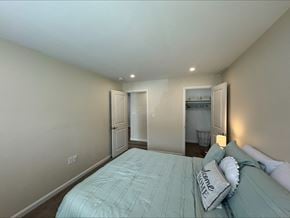 Fall River apartment for rent - A bedroom with a bed and a nightstand.