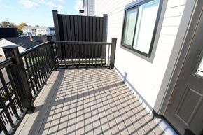 Middletown apartment for rent - a balcony with a black railing and a white house