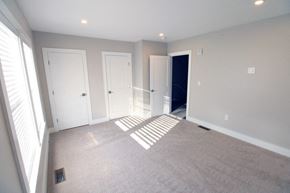 Middletown apartment for rent - an empty living room with three doors and a carpeted floor