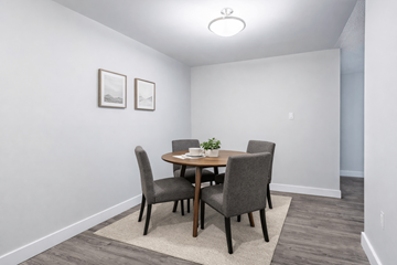 London apartment for rent - A dining room with a table and chairs.