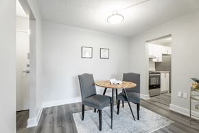 London apartment for rent - A dining room with a round table and chairs  at Platts Crossing, London, ON, N6H 4P4
