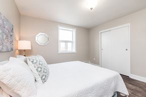 London apartment for rent - a bedroom with a large white bed and a window