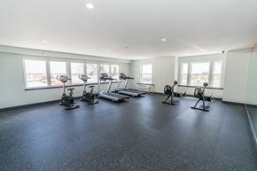 Norwalk apartment for rent - a spacious exercise room with treadmills and elliptical trainers