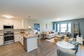 Norwalk apartment for rent - a kitchen and living room with hardwood floors and blue walls