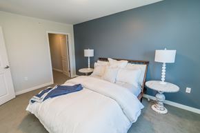 Norwalk apartment for rent - a bedroom with a bed and two lamps