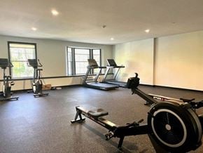 Norwalk apartment for rent - a room with a lot of exercise equipment in it