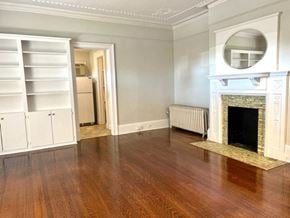 Norwalk apartment for rent - a living room with a fireplace and wooden floors
