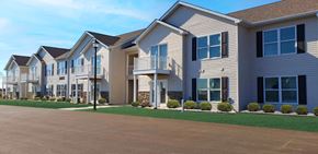 Belleville apartment for rent - a row of houses with balconies and a driveway