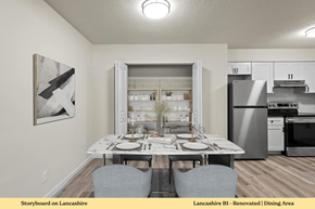 Edwardsville apartment for rent - A dining area with a table set for two and a painting on the wall.