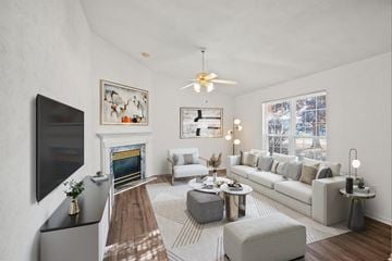 O'fallon apartment for rent - a living room with a white couch and a fireplace