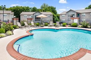 Swansea apartment for rent - our apartments have a large pool with chairs and umbrellas