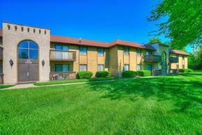 O'fallon apartment for rent - a building with a yard and grass in front of it