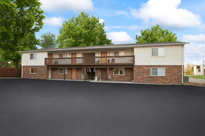 Fairview Heights apartment for rent - A two-story apartment building with a parking lot in front.