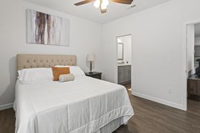 Barnhart apartment for rent - A bedroom with a large bed and a painting on the wall.