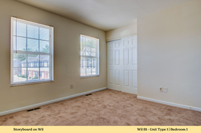 Dupo townhouse for rent - A bedroom with a carpeted floor and a window.