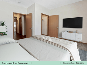 Greenville apartment for rent - a bedroom with a bed and a tv on the wall
